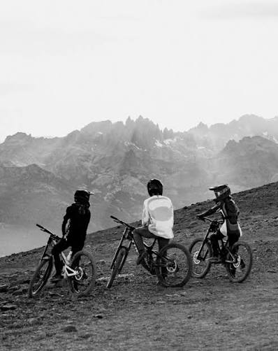 Mountain bikers overlooking a ridge