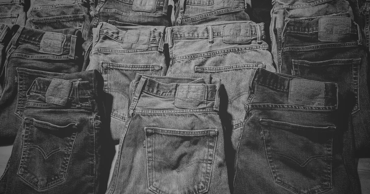 Rows of folded Levi's jeans, black and white
